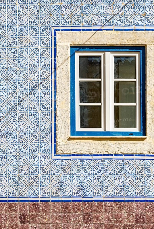 Traditional azulejo wall tiles and window