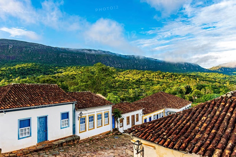 Quiet street in the historic city of Tiradentes with its old colonial-style houses and the mountain in the background