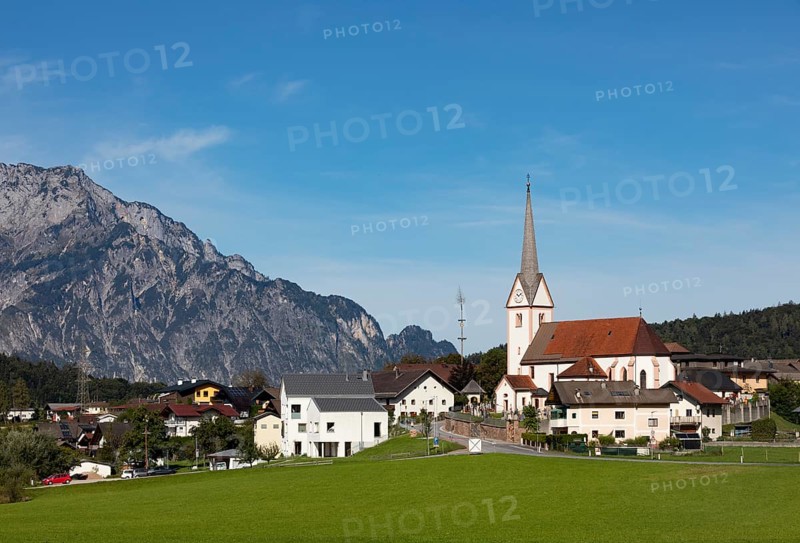 Village view with parish church of Adnet with Untersberg