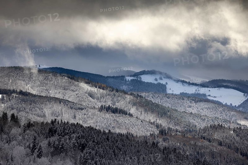 Fresh snow in November with a wonderful view of the Black Forest in a cloudy atmosphere