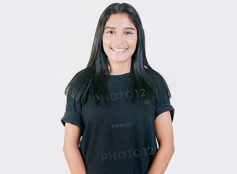 Portrait of happy Young girl with serene look isolated. Portrait of attractive latin girl smiling isolated. Nicaraguan woman concept in isolated background