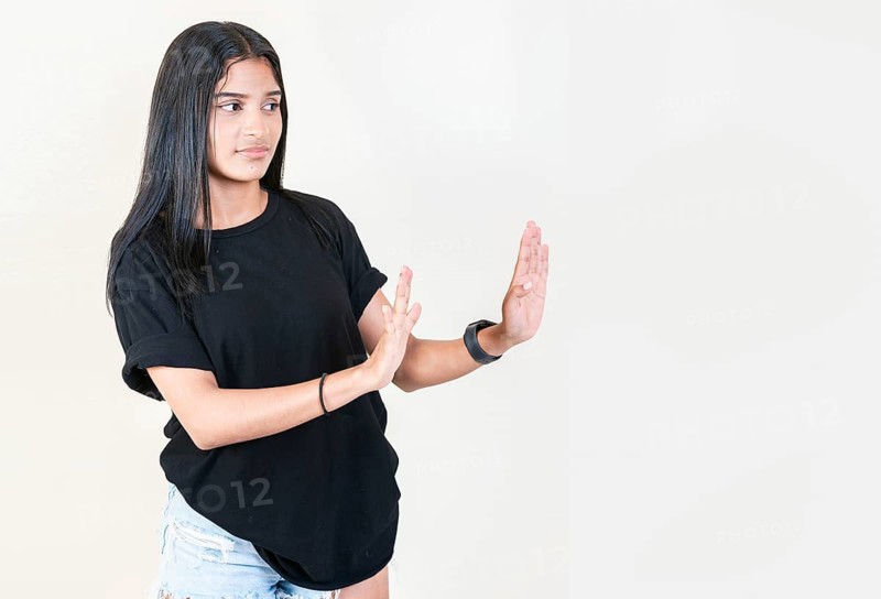 Displeased girl rejecting with palms hands isolated. Intense displeased young girl with rejection gesture. He frowns in disgust