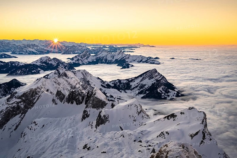 View from the Saentis to the mountains of Central Switzerland at sunset