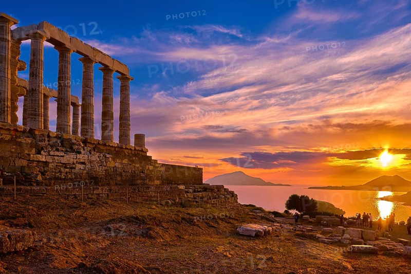 Beautiful sunset sky and ancient ruins of temple of Poseidon