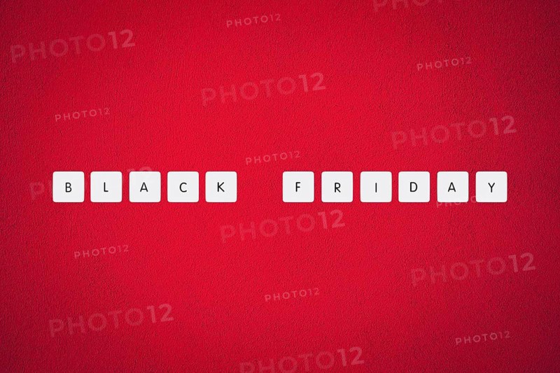 Black friday illustration composition. Text on board game chips. Red textured background