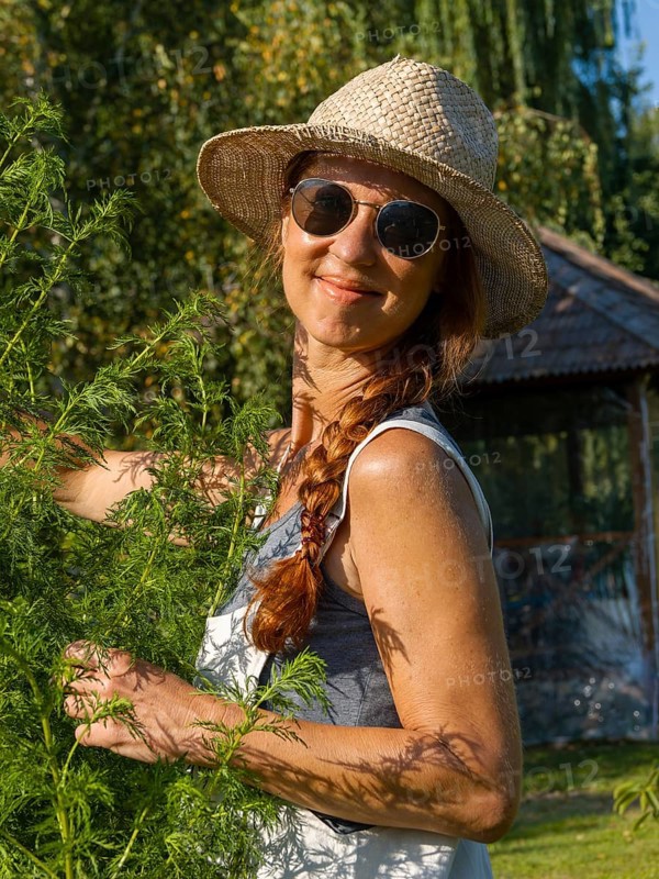 Woman in herb bed