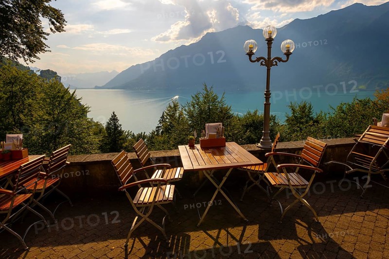 Restaurant Terrace View from The Historical Grandhotel Giessbach with View over Mountain and Lake Brienz with Sunlight in Giessbach