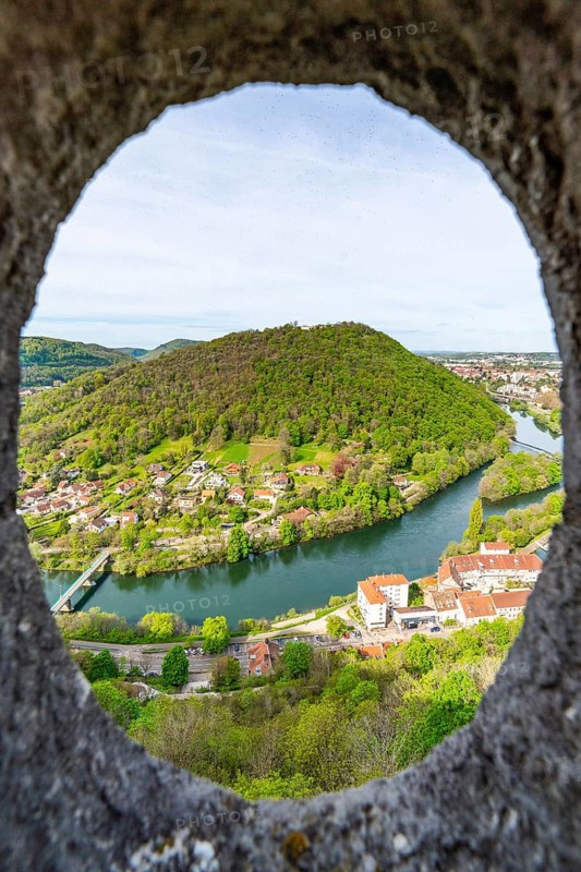 View of the Doubs River and the town of Besancon through a circular window in the World Heritage Site of Besancon Citadel