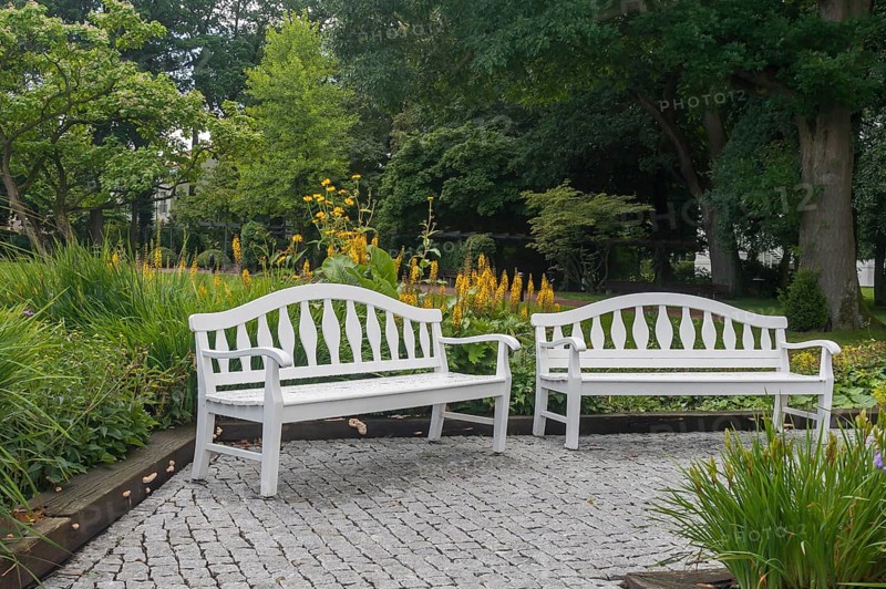 Two white park benches