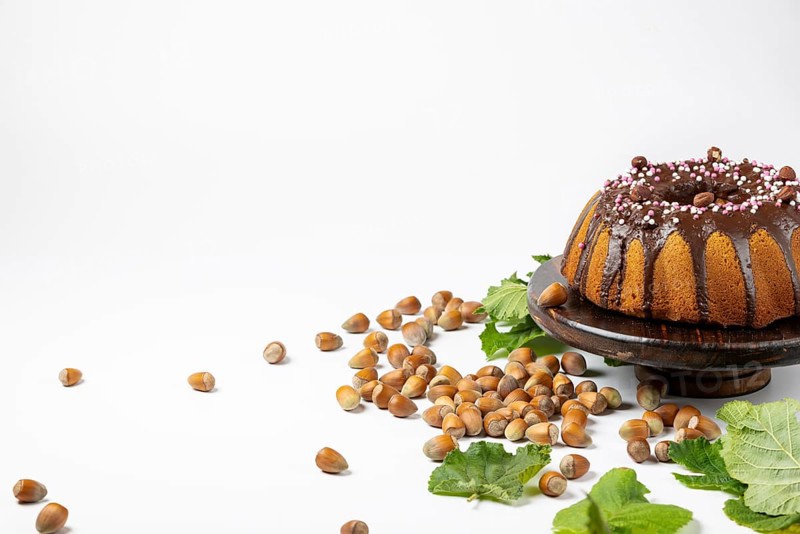 Vegan hazelnut cake on wooden serving plate