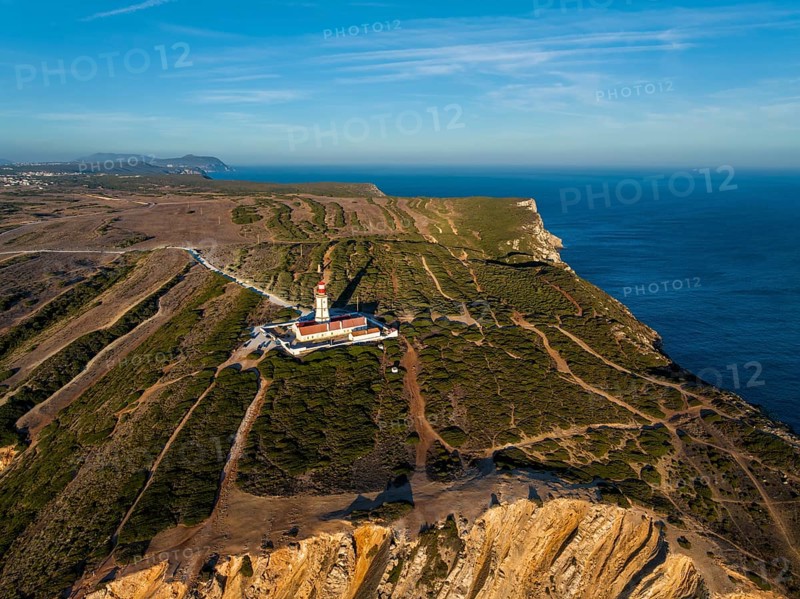 Aerial drone view of lighthouse on Cabo Espichel cape Espichel on Atlantic ocean