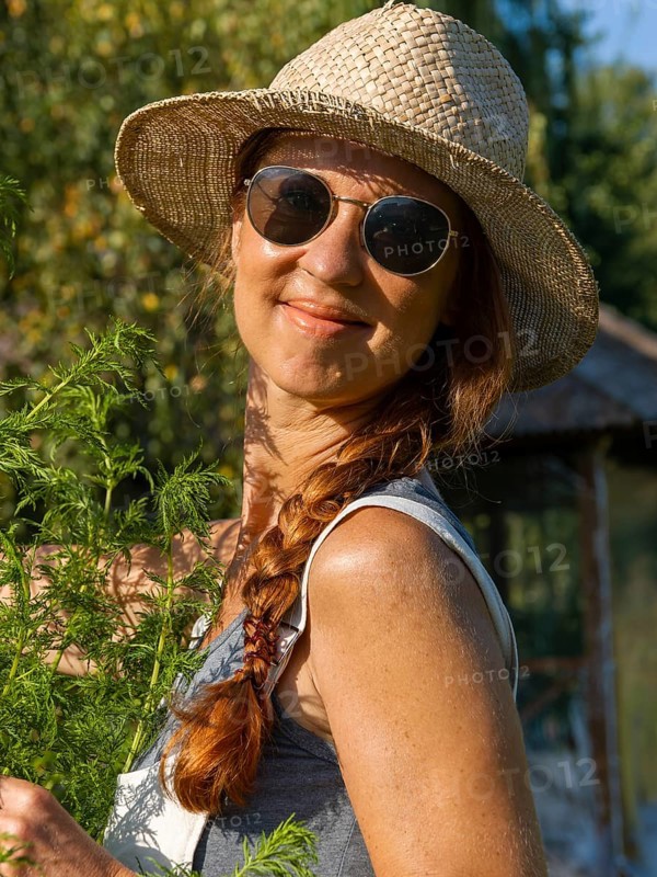Woman in herb bed