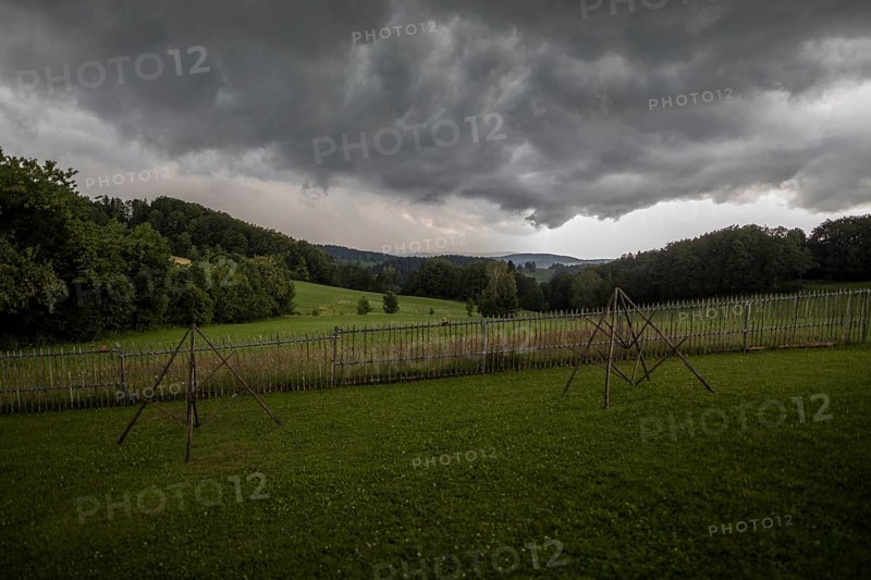 Rainy weather with meadow and farm