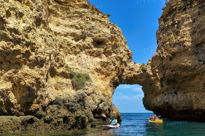 Tourists kayaking at Ponta da Piedade