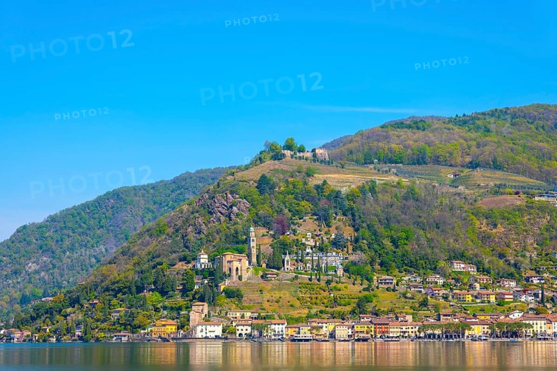 Alpine Lake Lugano with Mountain in a Sunny Day in Village Morcote