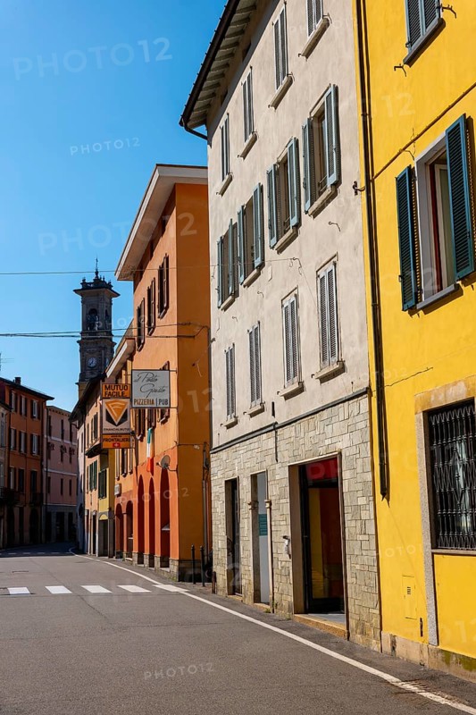 City Street in Porto Ceresio and Church Tower in a Sunny Summer Day in Porto Ceresio