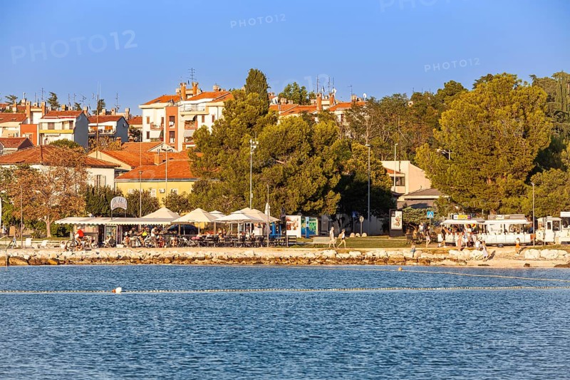 Beach on the stone coast of City Beach of Porec