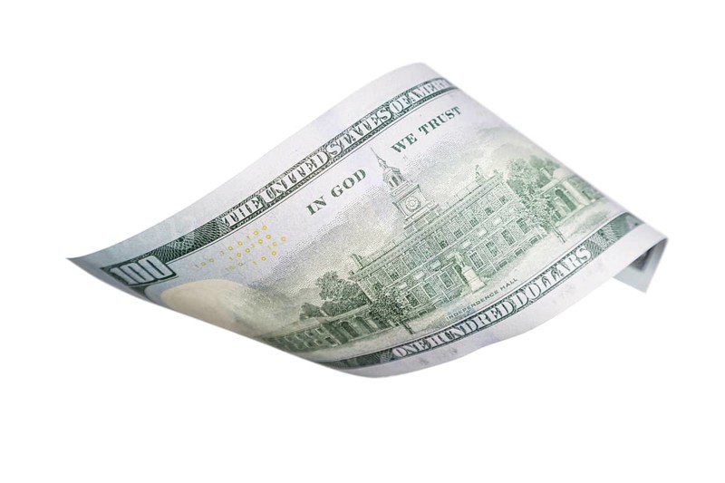 One hundred dollar bill falling or floating on empty background