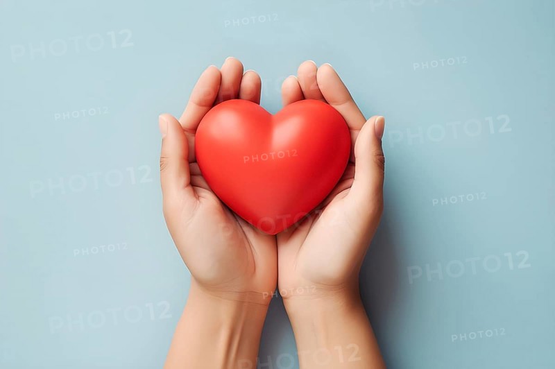 Top view showing woman's hands gently holding a fragile heart. AI generated