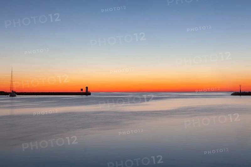 Sunset at the port entrance of Porec