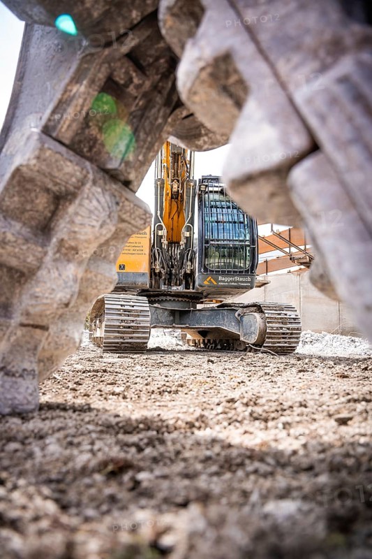 Yellow Liebherr crawler excavator recycling on demolition site