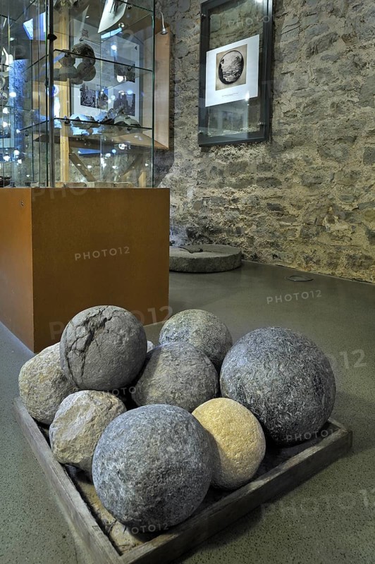 Stone cannonballs in exposition room of the medieval Franchimont Castle