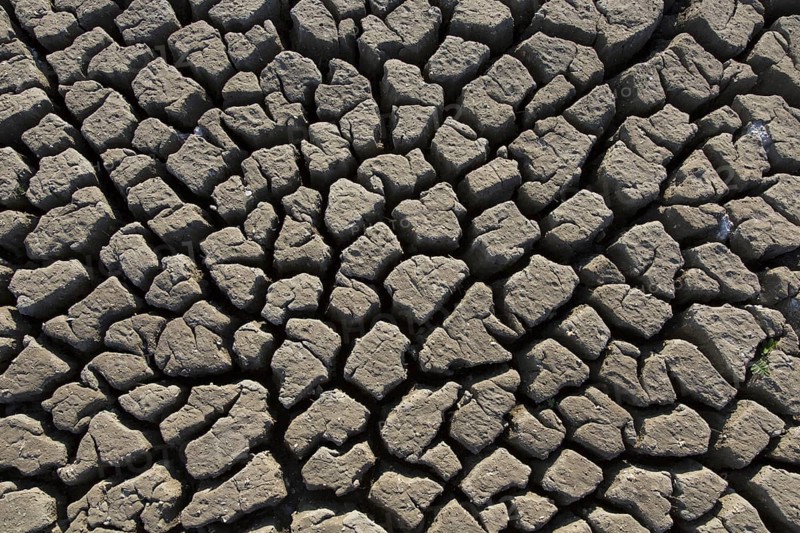Abstract pattern of dry cracked clay mud in dried up lake bed