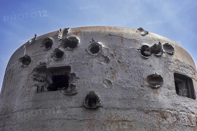 Battle-scarred World War Two 60 ton armoured bell of German coastal battery at D-Day Omaha Museum