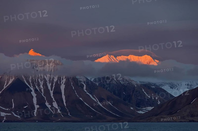 Mountains at sunset along the Hornsund fjord at Spitsbergen