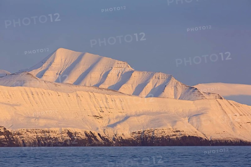Snow covered mountains at Billefjorden at sunset
