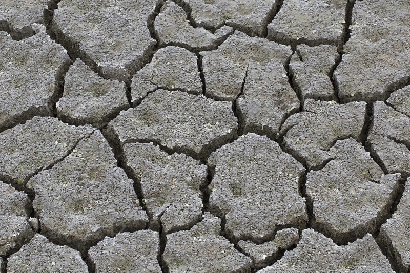 Abstract pattern of dry cracked clay mud in dried up lake bed