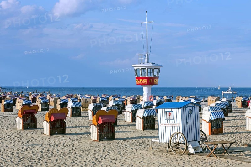 Roofed wicker beach chairs on the beach at Travemuende