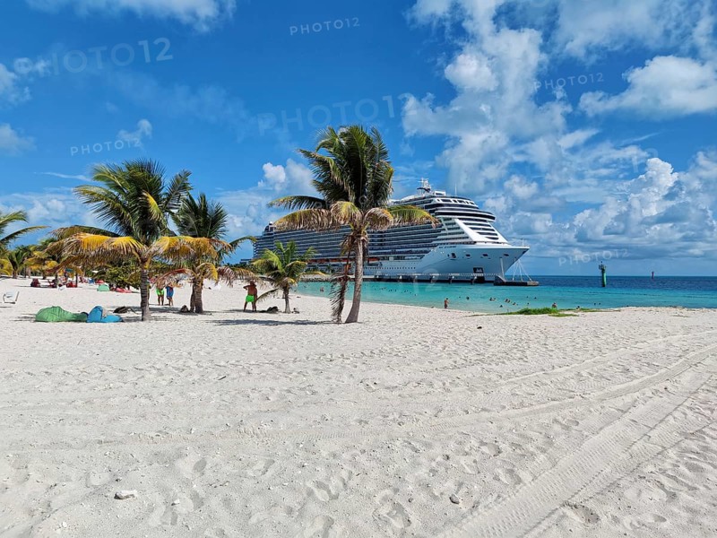 Lighthouse Bay and cruise ship MSC Seashore on the private island of the cruise line MSC Cruises