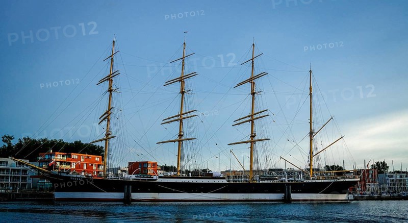 Museum sailing ship Passat in Priewall harbour at sunset