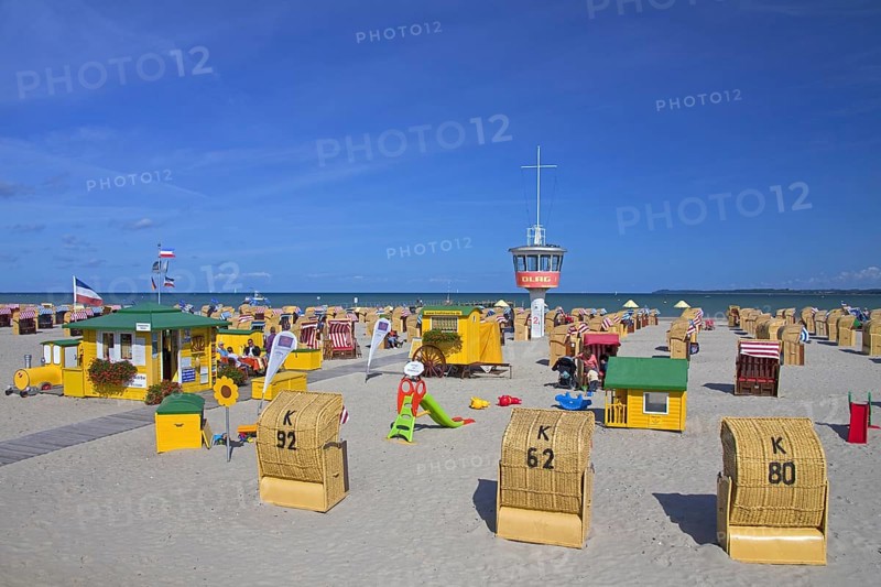 Roofed wicker beach chairs on the beach at Travemuende