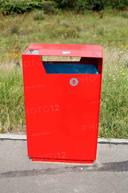 Red metal public waste bin