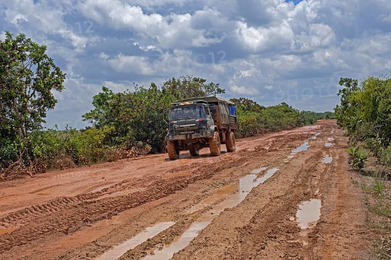 4x4 truck riding along the muddy Linden-Lethem dirt road linking Lethem and Georgetown in the rainy season
