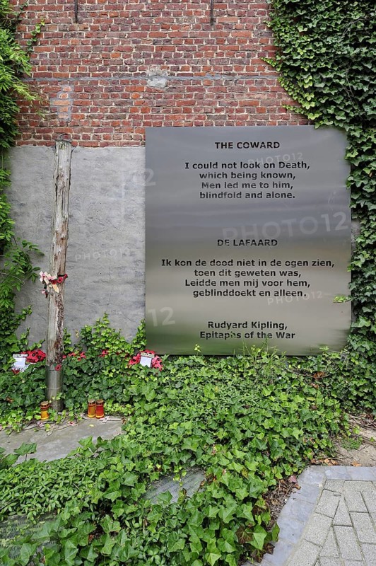 World War One execution pole and epitaph The Coward by Rudyard Kipling at inner courtyard of the Poperinge town hall