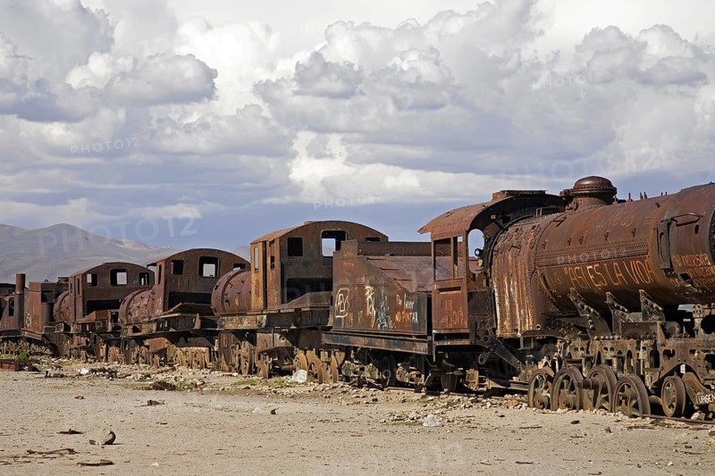 Rusty locomotive engines at cemetery of trains near Uyuni