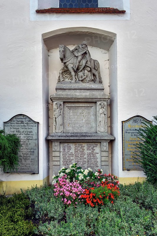 War memorial with floral decorations