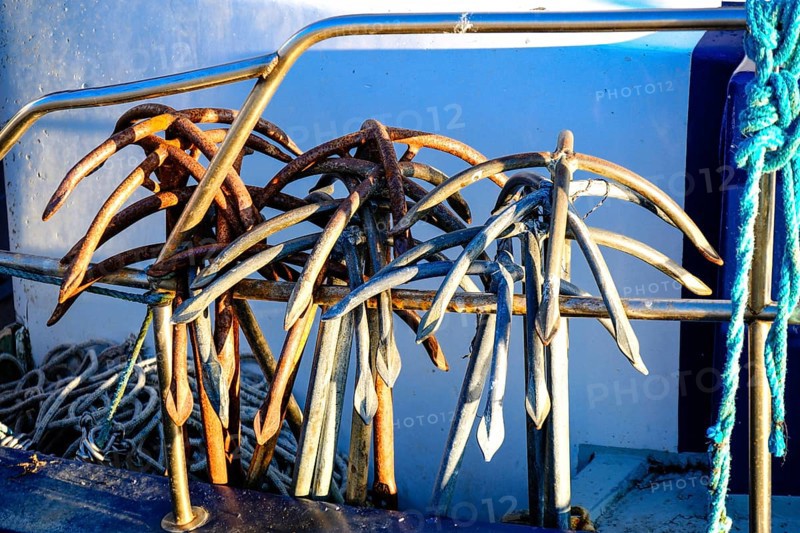 Metal anchors for fishing nets on a fishing cutter