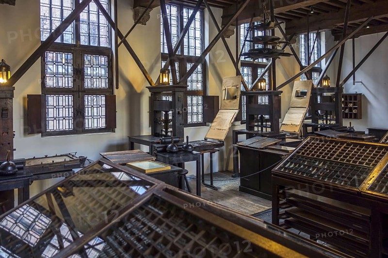 Print shop showing 18th century type cases and 17th century printing presses in the Plantin-Moretus Museum