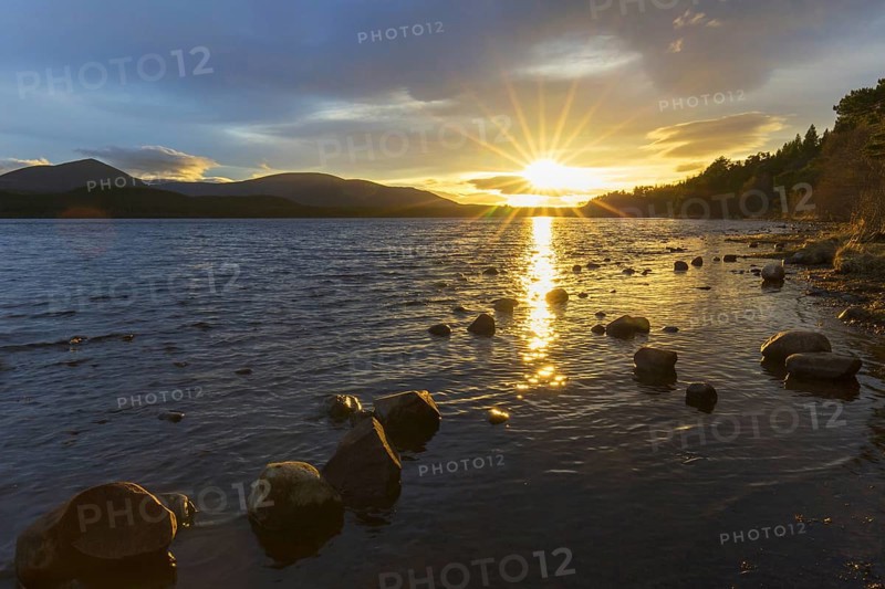 Loch Morlich and Cairngorm Mountains at sunset