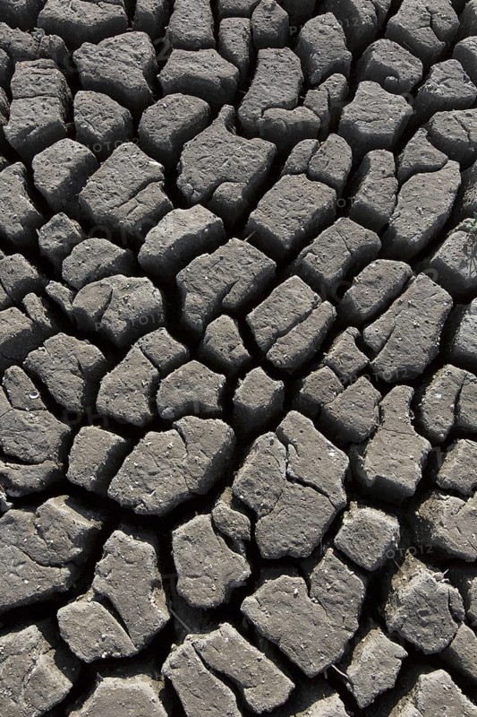 Abstract pattern of dry cracked clay mud in dried up lake bed