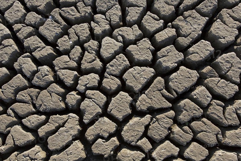 Abstract pattern of dry cracked clay mud in dried up lake bed