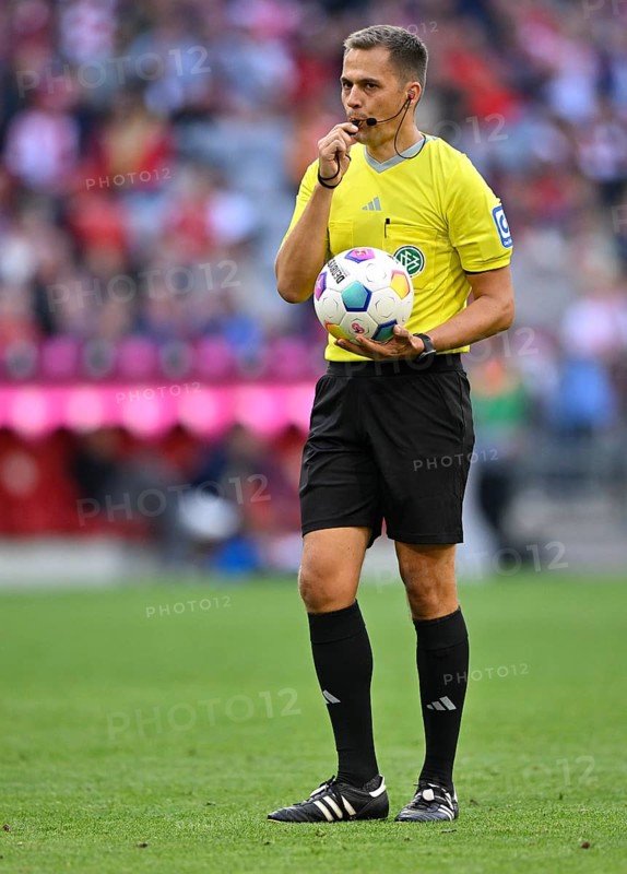 Referee Robert Hartmann blows the whistle
