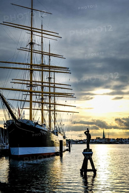 Museum sailing ship Passat in Priewall harbour at sunset