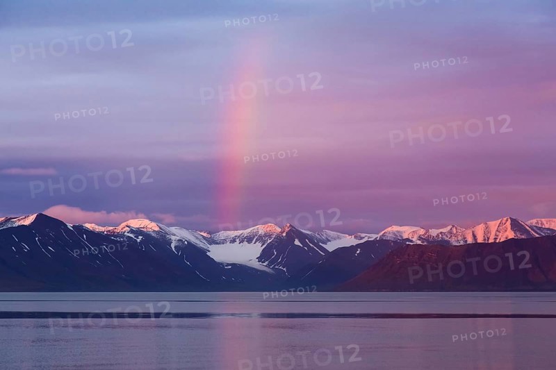 Rainbow over Liefdefjorden at sunset in summer