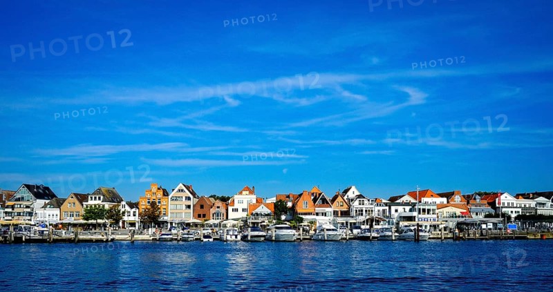 Front row commercial buildings and gastronomy in Travemuende on the river Trave. Hanseatic City of Luebeck. Schleswig-Holstein. Germany