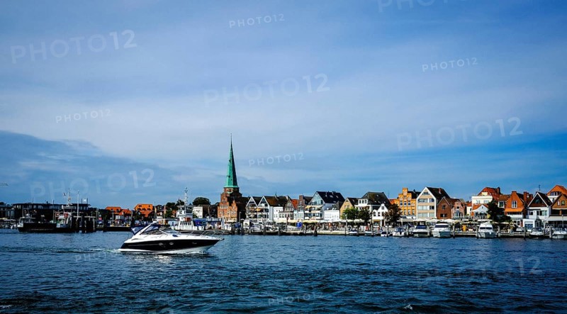 Trave with front rows of houses in Travemuende at the harbour. Hanseatic City of Luebeck